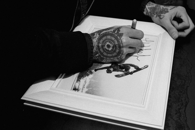 Mikkel Bang signing his life away.