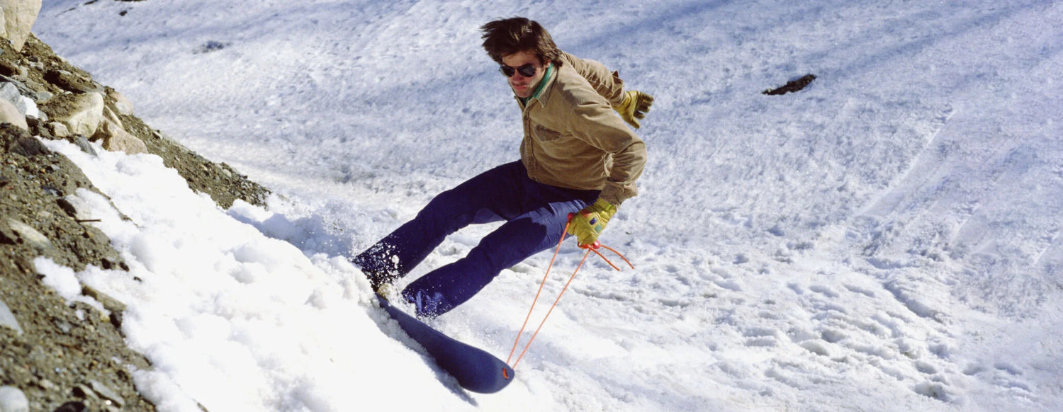 Person snowboarding down a snowy slope