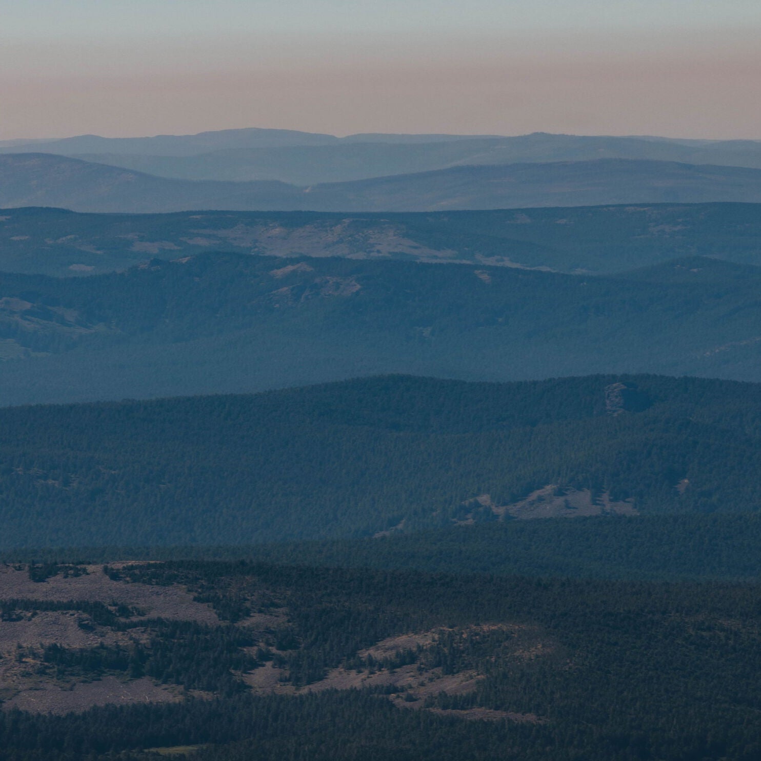 Hazy mountain landscape with layered terrain