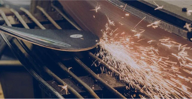 Metal cutting tool sharpening the edges of a snowboard 