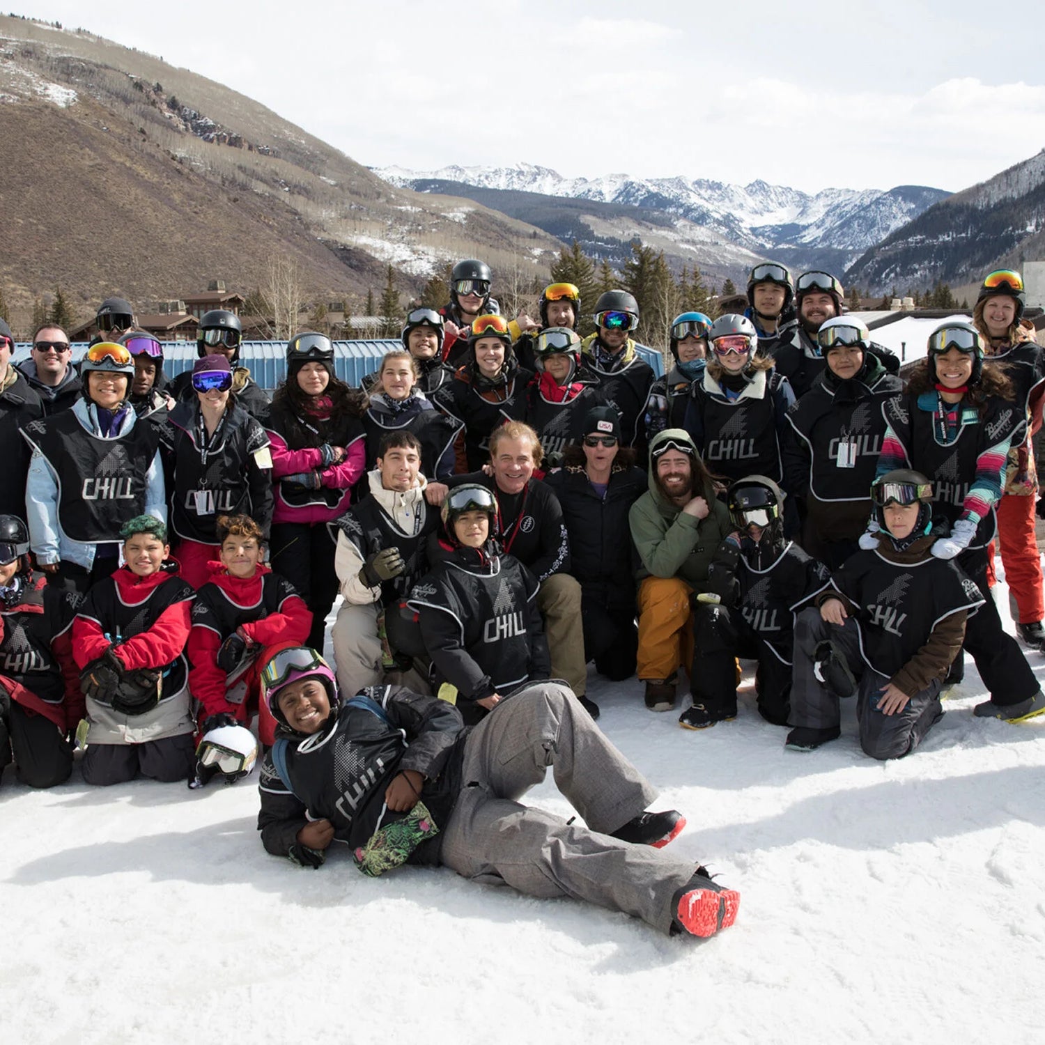 Jake Burton Carpenter posing with Chill Foundation participants