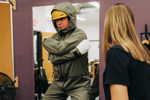 model tries on 2D Warp Knit outerwear