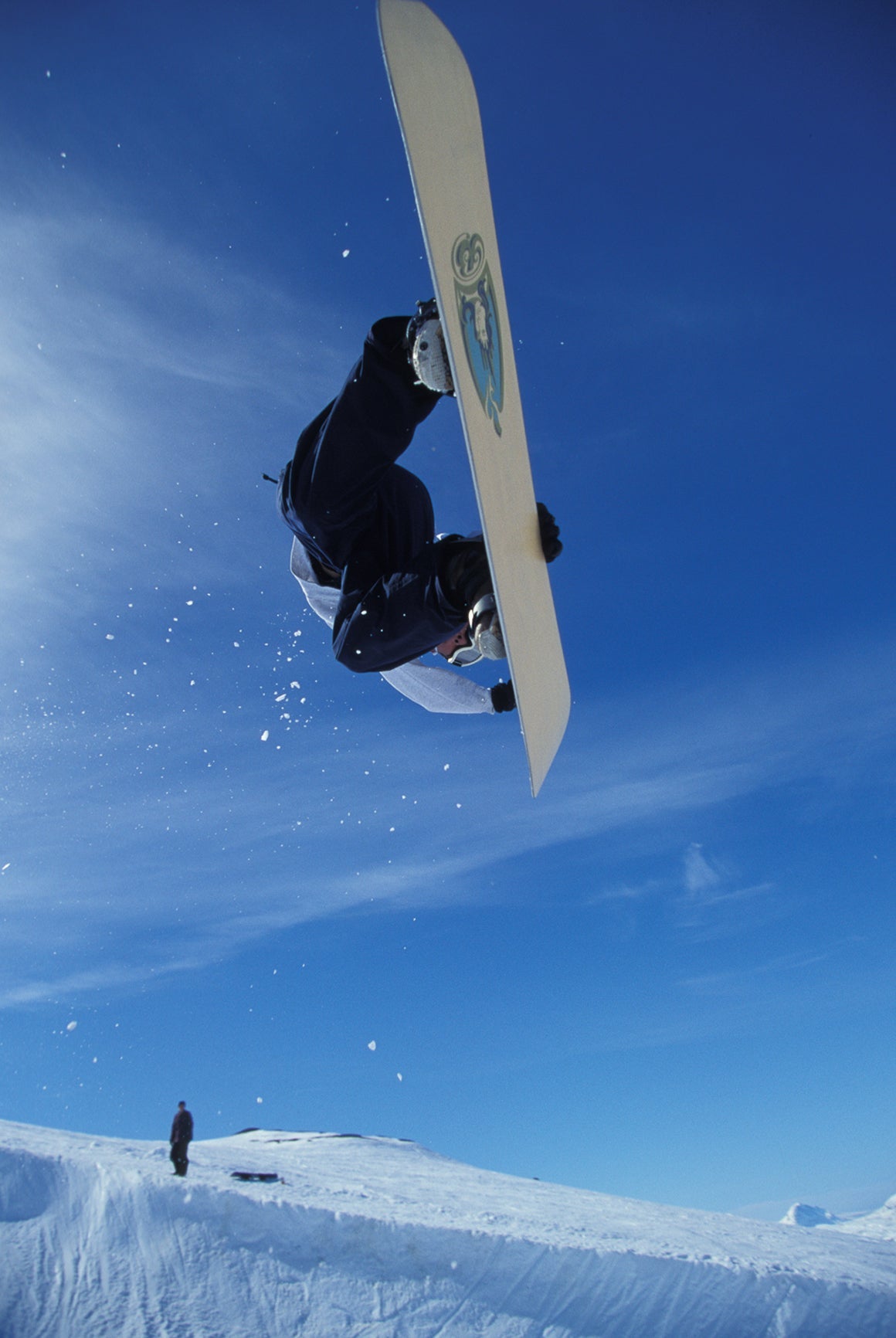 rider Bryan Iguchi  mid-air in snow