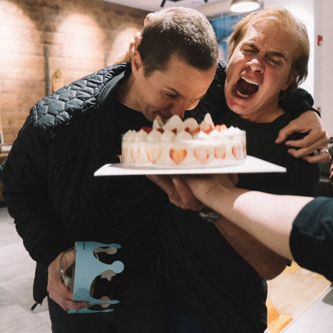 Jake smashes Burton CEO, John Lacy's face into a birthday cake