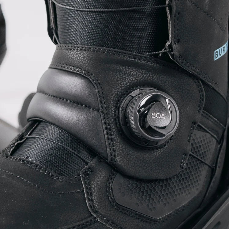 Close-up of a black boot with BOA system mechanism on a white background