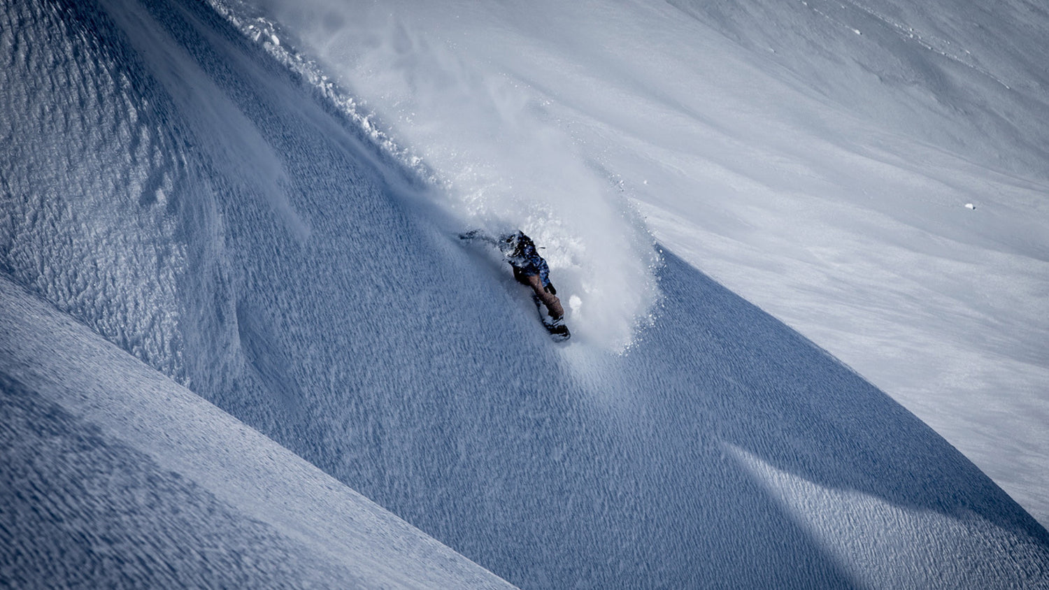 Jake Burton Carpenter riding powder
