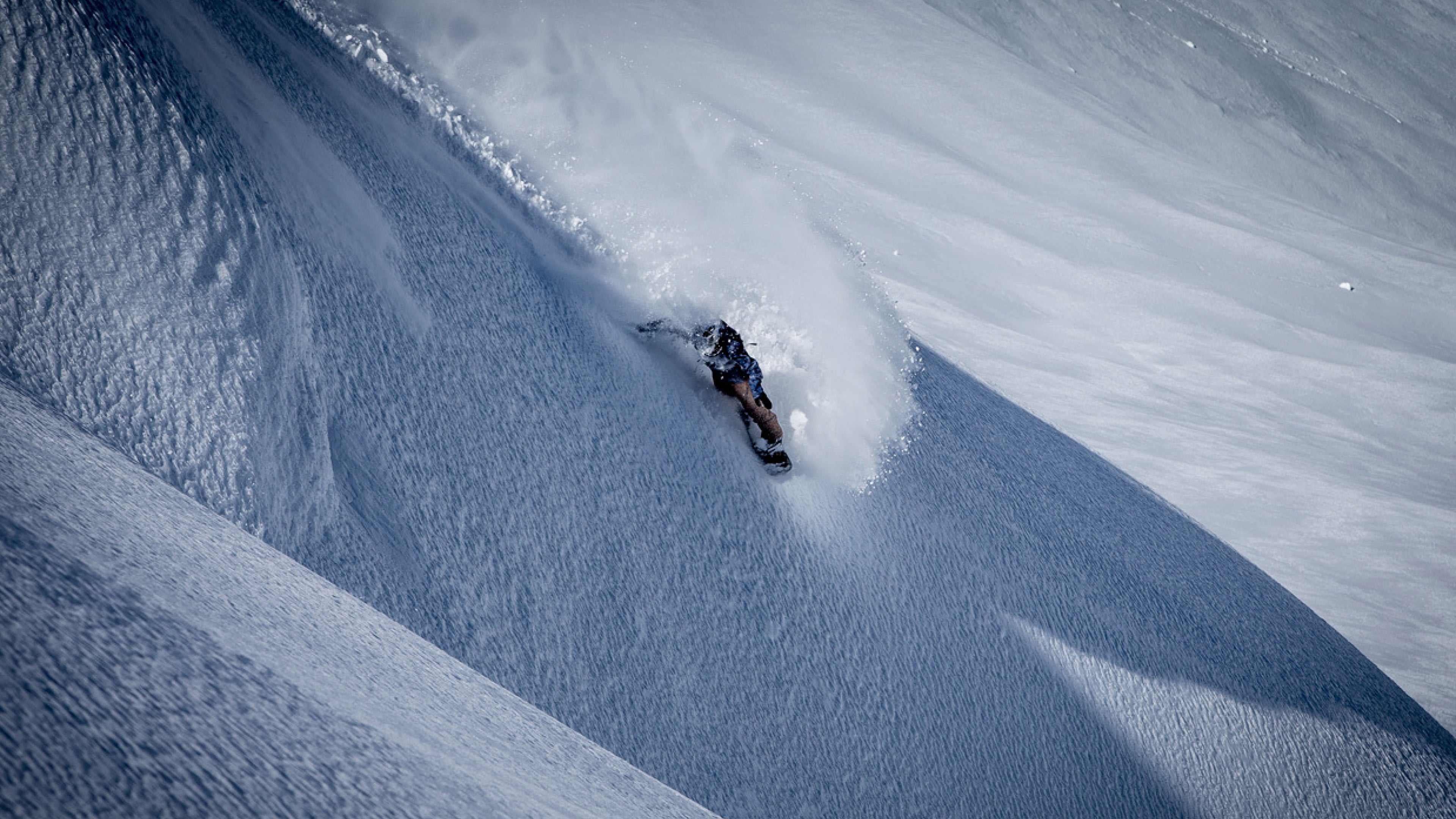 Jake Burton Carpenter riding powder