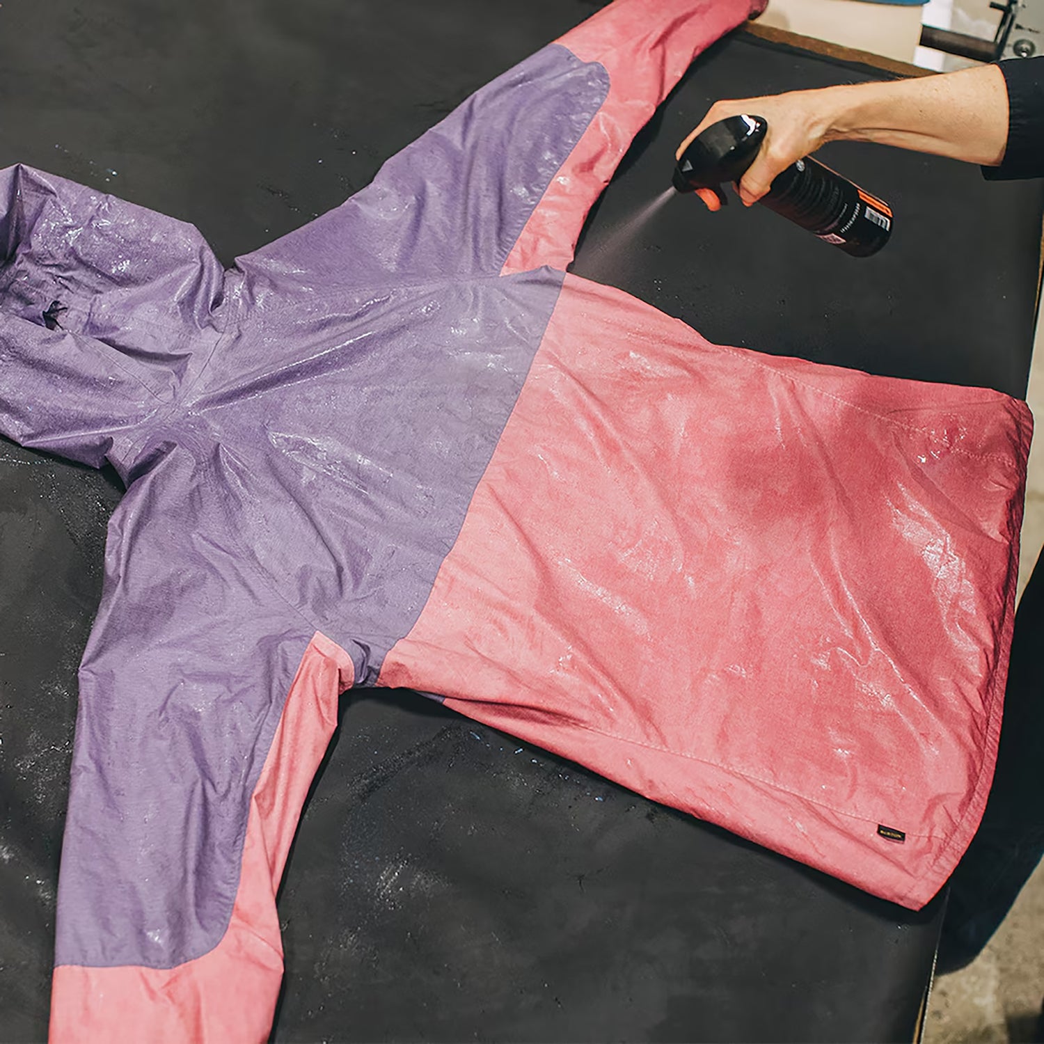 waterproof coating gets applied to a rain jacket