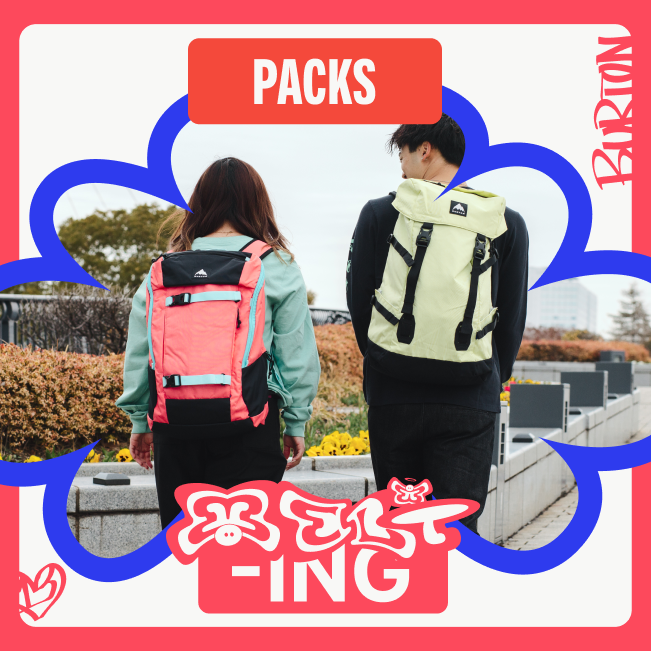 2 people wearing Burton backpacks going on a walk in the park