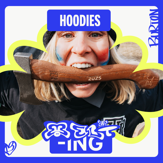 Ylfa R&uacute;narsd&oacute;ttir wearing a Burton hoodie and holding a hatchet in her teeth