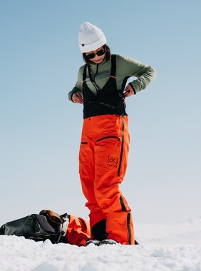 Women's Burton [ak] Tusk GORE-TEX PRO 3L Hi-Top Bib Pants shown in Signal Orange
